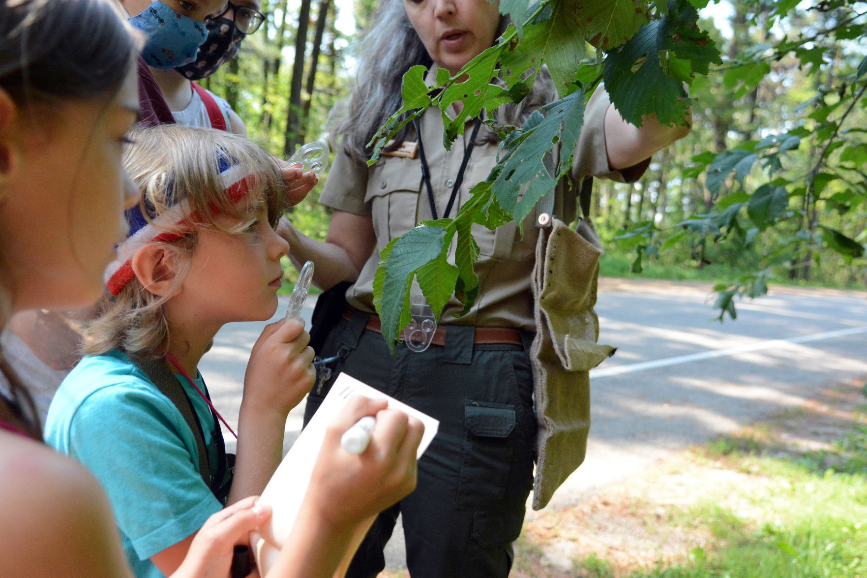 Examining leaves with the park naturalist